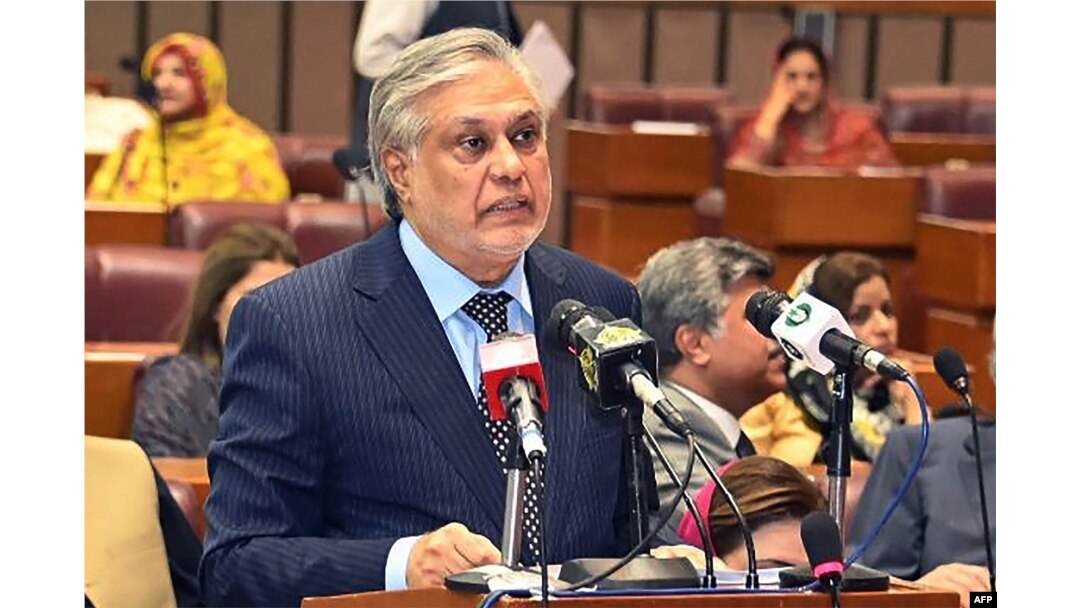 FILE - Pakistan's Finance Minister Ishaq Dar speaks in the national assembly in Islamabad, June 9, 2023, in this handout photograph taken by the Pakistan National Assembly.