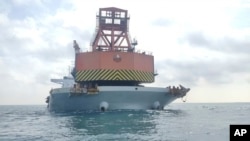 A China-registered bulk carrier ship detained by the Malaysian Maritime Enforcement Agency (MMEA) for anchoring illegally in the waters of east Johor is seen in this undated photo released May 29, 2023. (MMEA via AP)