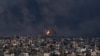 Fire and smoke rise following an Israeli airstrike, in Gaza City, Oct. 8, 2023. 