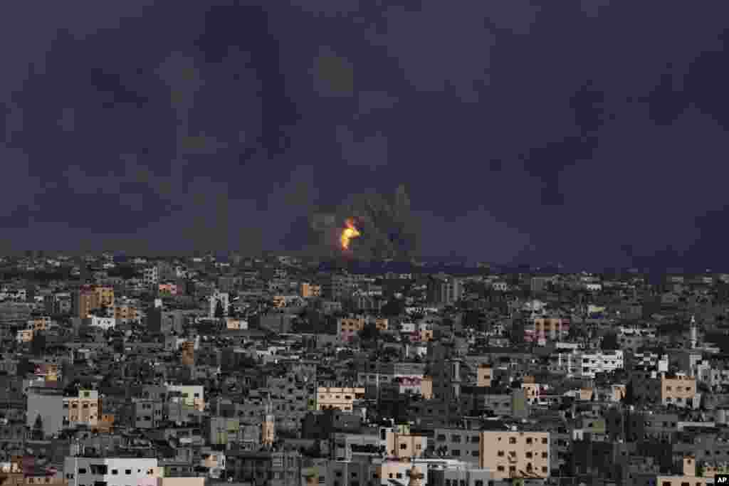 Fire and smoke rise following an Israeli airstrike in Gaza City, Oct. 8, 2023.