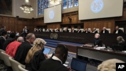 Judges and parties sit during a hearing at the International Court of Justice in The Hague, Netherlands, Jan. 12, 2024.