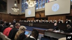 Judges and parties sit during a hearing at the International Court of Justice in The Hague, Netherlands, Jan. 12, 2024.