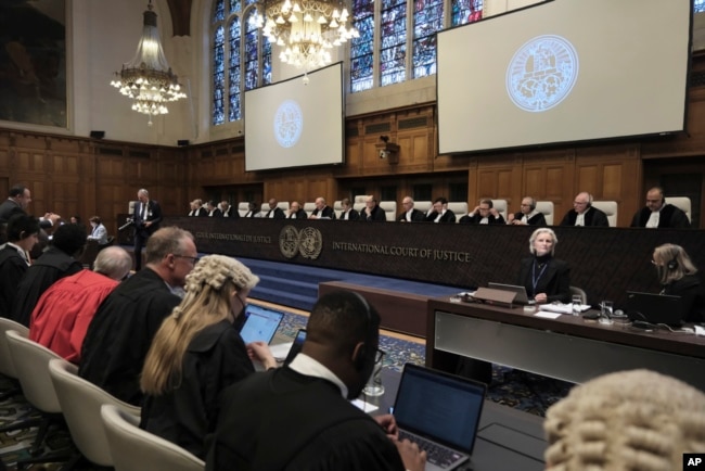 Judges and parties sit during a hearing at the International Court of Justice in The Hague, Netherlands, Jan. 12, 2024.