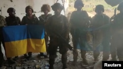 Ukrainian soldiers say they have recaptured the Ukrainian village of Staromaiorske, in Donetsk region, Ukraine, in this screen grab from video posted by Ukrainian President Volodymyr Zelenskyy and released on July 27, 2023. Volodymyr Zelenskyy and released on July 27, 2023. (Telegram/V_Zelenskiy_official/via Reuters)