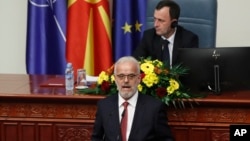 Talat Xhaferi, nominated to serve as prime minister of North Macedonia's caretaker government, speaks to lawmakers during a session of parliament, in Skopje, Jan. 28, 2024.