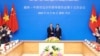 Ngoại trưởng Trung Quốc Vương Nghị bắt tay Phó Thủ tướng Việt Nam Trần Lưu Quang tại hội nghị của Ủy ban Chỉ đạo Hợp tác Song phương Việt Nam-Trung Quốc ở Hà Nội hôm 1/12.