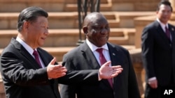 FILE - South Africa's President Cyril Ramaphosa, right, with Chinese President Xi Jinping during a state visit at Union Building in Pretoria, South Africa, on Aug. 22, 2023.