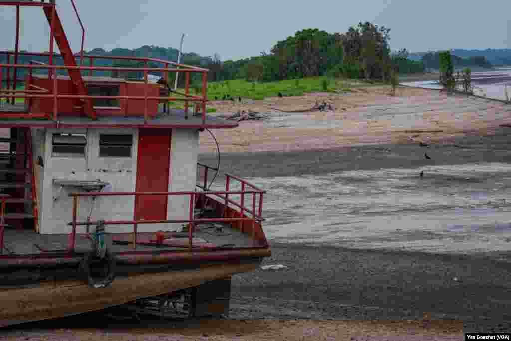 The waters of the Amazonian rivers have dropped rapidly, and many boats are stranded in the mud and the dry riverbed in Manaus, Oct. 3, 2023.