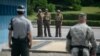 한반도 비무장지내 내 공동경비구역(JSA)에서 북한군 장병이 미군(오른쪽)과 한국군(왼쪽)을 촬영하고 있다. (자료사진)