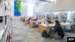 FILE — Students at the Bishop's University Library Learning Commons in Sherbrooke, Quebec, Canada, Nov. 20, 2023. Canada has announced new caps on the number of foreign student applications that will be accepted each year,