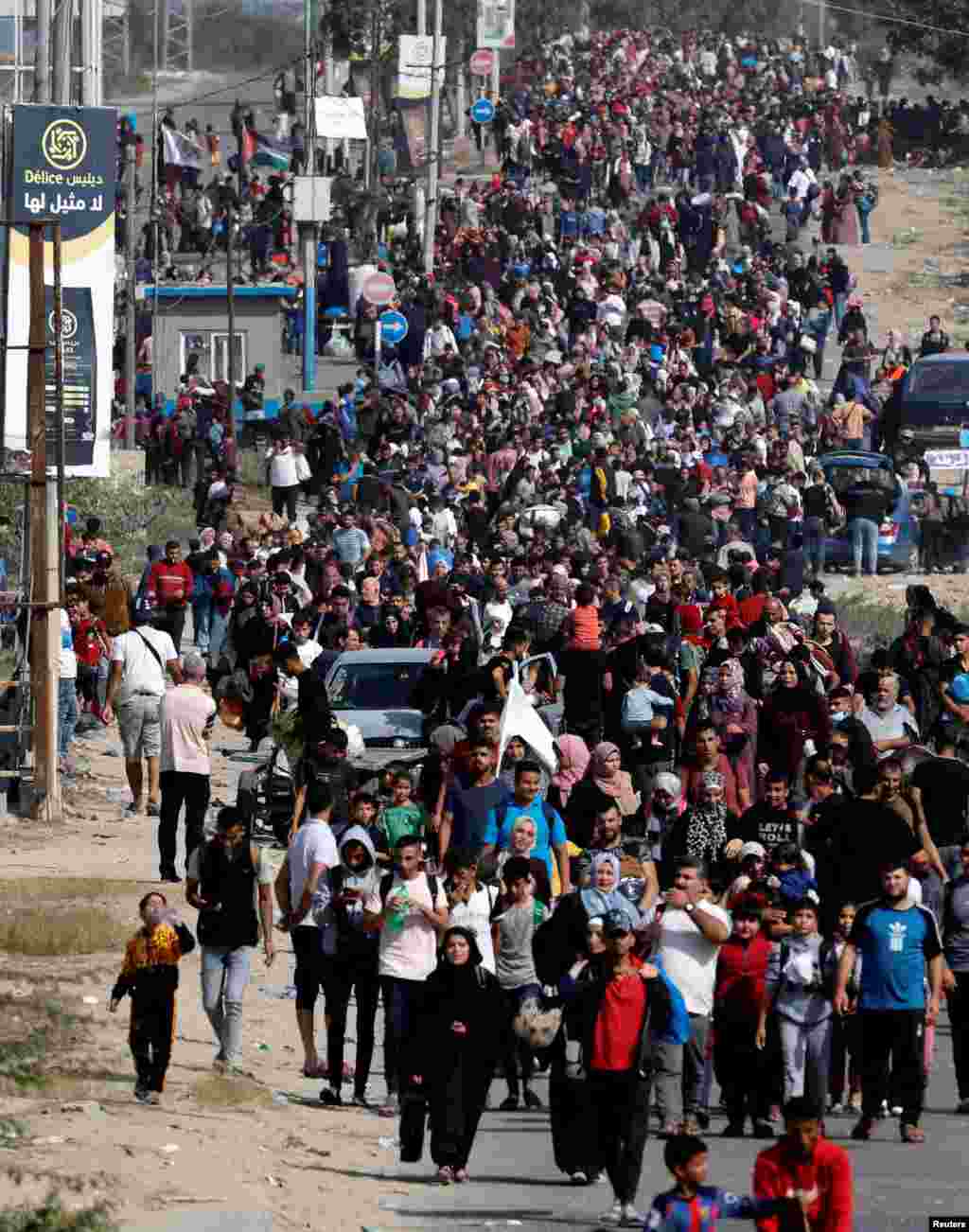 Palestinians fleeing north Gaza walk towards the south&nbsp;in the central Gaza Strip amid the ongoing conflict between Israel and Palestinian Islamist group Hamas.