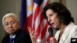 U.S. Commerce Secretary Gina Raimondo talks beside Philippine Trade and Industry Secretary Alfredo Pascual during a press conference at Paranaque, Philippines, March 11, 2024.