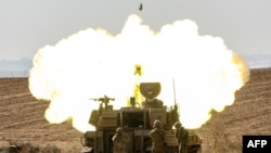 An Israeli army self-propelled howitzer fires rounds near the border with Gaza in southern Israel.&nbsp;Israel declared war on Hamas on October 8 following a shock land, air, and sea assault by the Gaza-based militant group.&nbsp;