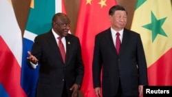 FILE - South African President Cyril Ramaphosa and Chinese President Xi Jinping attend the BRICS Summit in Johannesburg on Aug. 24, 2023. China on Jan. 29, 2024, voiced cautious support for an international court's ruling in South Africa's genocide case against Israel.