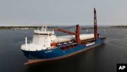FILE - The ship UHL Felicity, carrying parts for offshore wind generators, arrives to dock, Could presumably perchance additionally 24, 2023, in Unique Bedford, Mass.