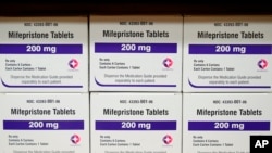 FILE - Boxes of the drug mifepristone sit on a shelf at the West Alabama Women's Center in Tuscaloosa, Alabama, March 16, 2022. 