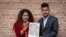 Same-sex couple Surendra Pandey, right, and Maya Gurung, who got married six years ago, pose for a photograph with their marriage certificate in Kathmandu, Nepal, Dec. 1, 2023.