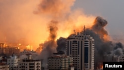 Smoke and flames rise following Israeli strikes in Gaza, Oct. 9, 2023. Israel's chief military spokesperson says Israel had reestablished control of areas near Gaza that Hamas militants stormed in the incursion that began Saturday.