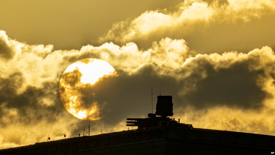 FILE - An air defense system is seen during sunset on the roof of the main building of the Russian Defense Ministry in Moscow, Nov. 1, 2023. Air defense systems have been put in many areas of Moscow as protection against Ukrainian drone attacks. 