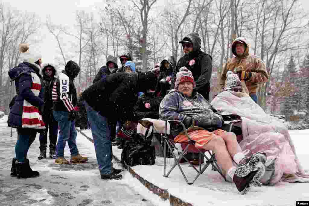 People wait in line before the start of a campaign rally with former U.S. President and Republican presidential candidate Donald Trump ahead of the New Hampshire primary election, in Atkinson, New Hampshire, Jan. 16, 2024.