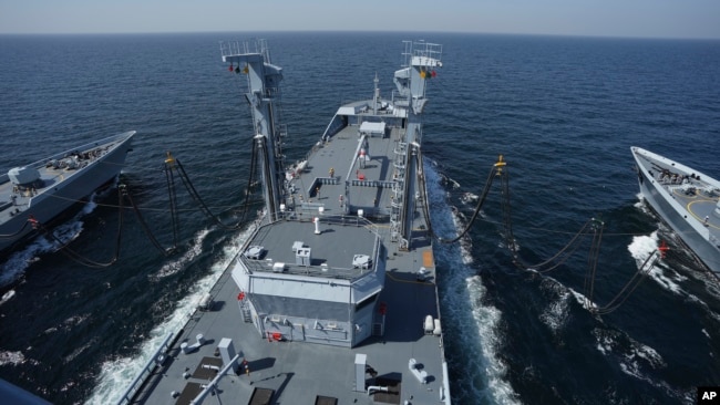 FILE - Pakistani warships conduct a refueling demo during naval drills in the Arabian Sea, off the coast of Karachi, Pakistan, Feb. 13, 2023.