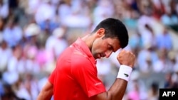 Serbia's Novak Djokovic celebrates a point against Norway's Casper Ruud during their men's singles final match on day fifteen of the Roland-Garros Open tennis tournament at the Court Philippe-Chatrier in Paris on June 11, 2023. 