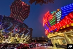 FILE - Casino Lisboa, right, is seen in Macao, Dec. 28, 2022.
