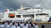 Philippine Coast Guard personnel wave Vietnamese and Filipino flags to welcome the Vietnam Coast Guard (VCG) ship, CSB 8002, in Manila, Philippines, Aug. 2024. 