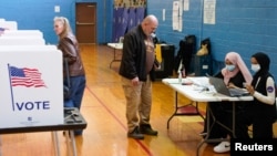 FILE - Voting in Detroit, Michigan, for the primary presidential election, Feb. 27, 2024. 