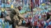 (FILE) A wounded Ukrainian serviceman visits a designated area for commemorating fallen Ukrainian soldiers at the Independence Square in Kyiv on August 29, 2024.