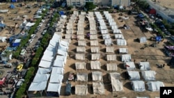 Tents for Palestinians displaced by the Israeli bombardment of the Gaza Strip are set up in Khan Younis, Oct. 19, 2023.