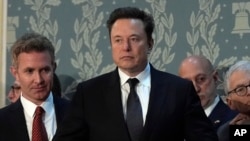 Elon Musk arrives before a joint meeting of Congress at the Capitol in Washington, July 24, 2024. Five secretaries of state are urging Elon Musk to fix an AI chatbot on his social media platform X, saying in a letter, August. 5, 2024, that it has spread election misinformation. 