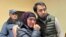 Uzbek blogger Olimjon Haydarov, right, puts his arm around his mother after the verdict in a Ferghana criminal court, Uzbekistan, Dec. 1, 2023.