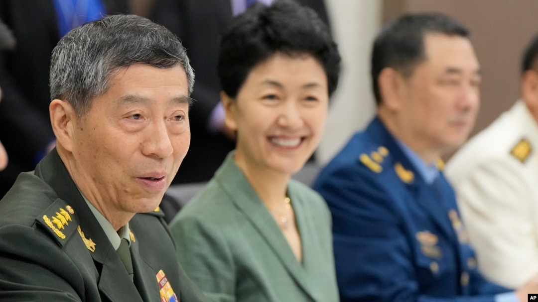 FILE- Chinese Defense Minister Gen. Li Shangfu, left, talks with Singapore Defense Minister Ng Eng Hen, unseen, at the defense ministry in Singapore, June 1, 2023.