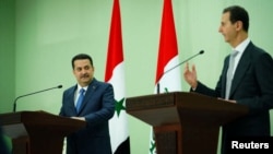 Syria's President Bashar al-Assad and Iraqi Prime Minister Mohammed Shia Al-Sudani attend a news conference, in Damascus, Syria July 16, 2023. (Iraqi Prime Minister's Media Office/Handout via Reuters) 