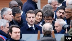 President of the Paris Organizing Committee of the 2024 Olympic and Paralympic Games Tony Estanguet, President Macron, Minister for Sports and Olympics Amelie Oudea-Castera and other officials attend the inauguration of the Olympic village in Saint-Denis, Feb. 29, 2024. 