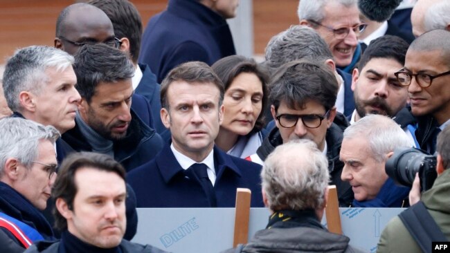 President of the Paris Organizing Committee of the 2024 Olympic and Paralympic Games Tony Estanguet, President Macron, Minister for Sports and Olympics Amelie Oudea-Castera and other officials attend the inauguration of the Olympic village in Saint-Denis, Feb. 29, 2024.