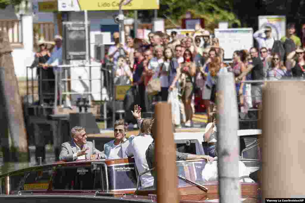 George Clooney, left, and Brad Pitt arrive for the press conference of the film &#39;Wolfs&#39; during the 81st edition of the Venice Film Festival in Venice, Italy.