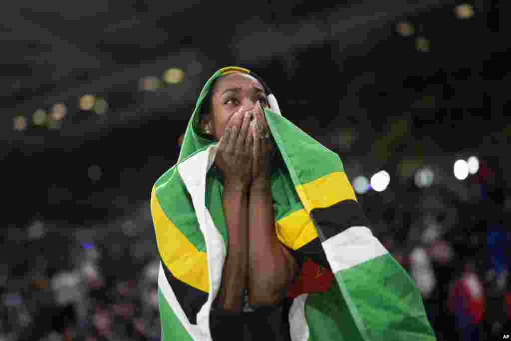 Thea Lafond of Dominica reacts after winning the gold medal in the women&#39;s triple jump during the World Athletics Indoor Championships at the Emirates Arena in Glasgow, Scotland.