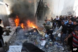 Palestinians look for survivors after an Israeli strike on Rafah, Gaza Strip, Nov. 17, 2023.