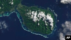 This NASA satellite photo shows the southern part of the French Polynesian island of Tahiti, with the Olympic venue Teahupo'o at center on the southern coast. It was chosen as the surfing venue for next year's Paris Olympics because it is so fearsome.