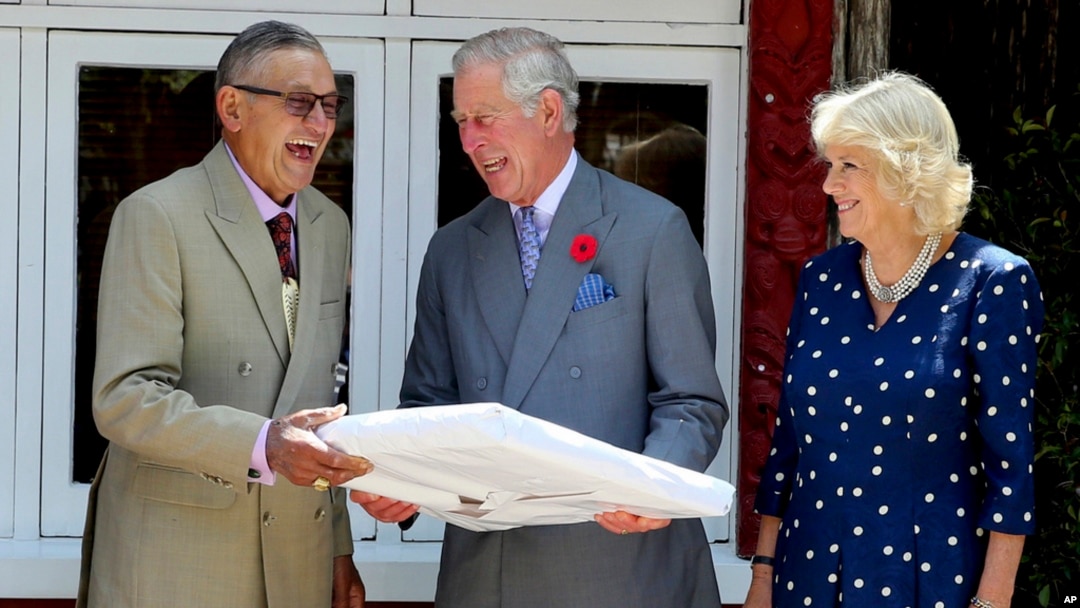 FILE - New Zealand Maori king Kiingi Tuheitia, left, reacts with Prince Charles, Prince of Wales, and Camilla, Duchess of Cornwall, at Turangawaewae Marae, Hamilton, New Zealand, Nov. 8, 2015.