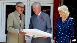 FILE - New Zealand Maori king Kiingi Tuheitia, left, reacts with Prince Charles, Prince of Wales, and Camilla, Duchess of Cornwall, at Turangawaewae Marae, Hamilton, New Zealand, Nov. 8, 2015.