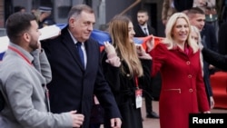 FILE - Serbian President Milorad Dodik, and Serb member of Bosnia's tripartite inter-ethnic presidency Zeljka Cvijanovic march during a parade to celebrate Serb Republic national holiday, banned by the constitutional court, in East Sarajevo, Bosnia and Herzegovina, Jan. 9, 2023.