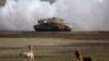 FILE - An Israeli Merkava tank is pictured during an exercise in the Israel-controlled Golan Heights, Jan. 11, 2016. The Biden administration wants approval to sell 45,000 shells for the tanks for Israel's offensive against Hamas in Gaza.