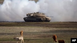 FILE - An Israeli Merkava tank is pictured during an exercise in the Israel-controlled Golan Heights, Jan. 11, 2016. The Biden administration wants approval to sell 45,000 shells for the tanks for Israel's offensive against Hamas in Gaza.
