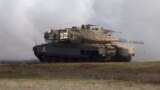 FILE - An Israeli Merkava tank is pictured during an exercise in the Israel-controlled Golan Heights, Jan. 11, 2016. The Biden administration wants approval to sell 45,000 shells for the tanks for Israel's offensive against Hamas in Gaza.