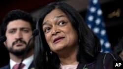 Congressional Progressive Caucus Chair Rep. Pramila Jayapal, D-Wash., right, next to Rep. Greg Casar, speaks about the threat of default during a news conference, May 24, 2023, on Capitol Hill in Washington.