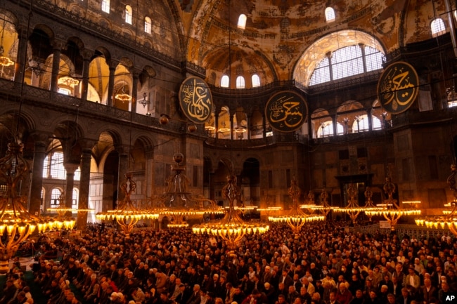 FILE - Muslim worshippers pray during the Muslim holy fasting month of Ramadan at Hagia Sophia mosque in Istanbul, Turkey, April 14, 2023.