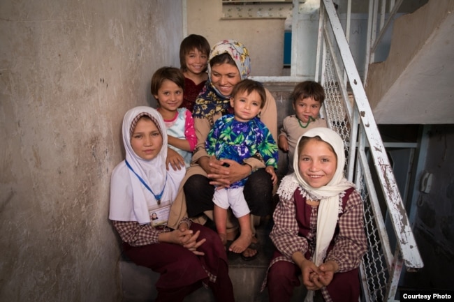 Nonprofit group Too Young to Wed persuaded Parwana Malik’s elderly husband to return her to her family. Parwana, front right, is among seven sisters and one brother, not all of whom are pictured. (Too Young to Wed)